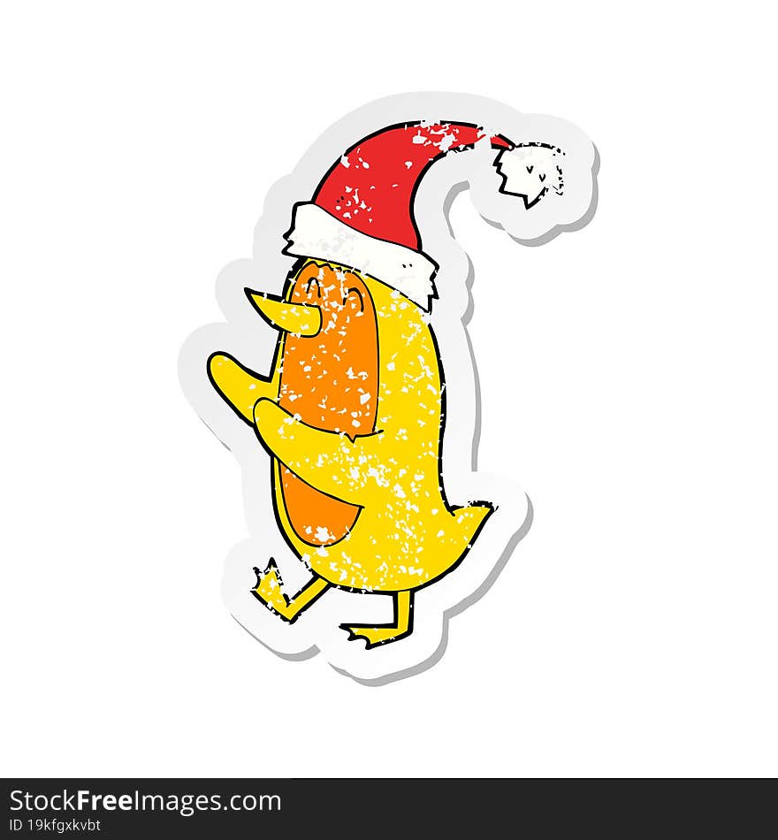 retro distressed sticker of a cartoon bird wearing xmas hat