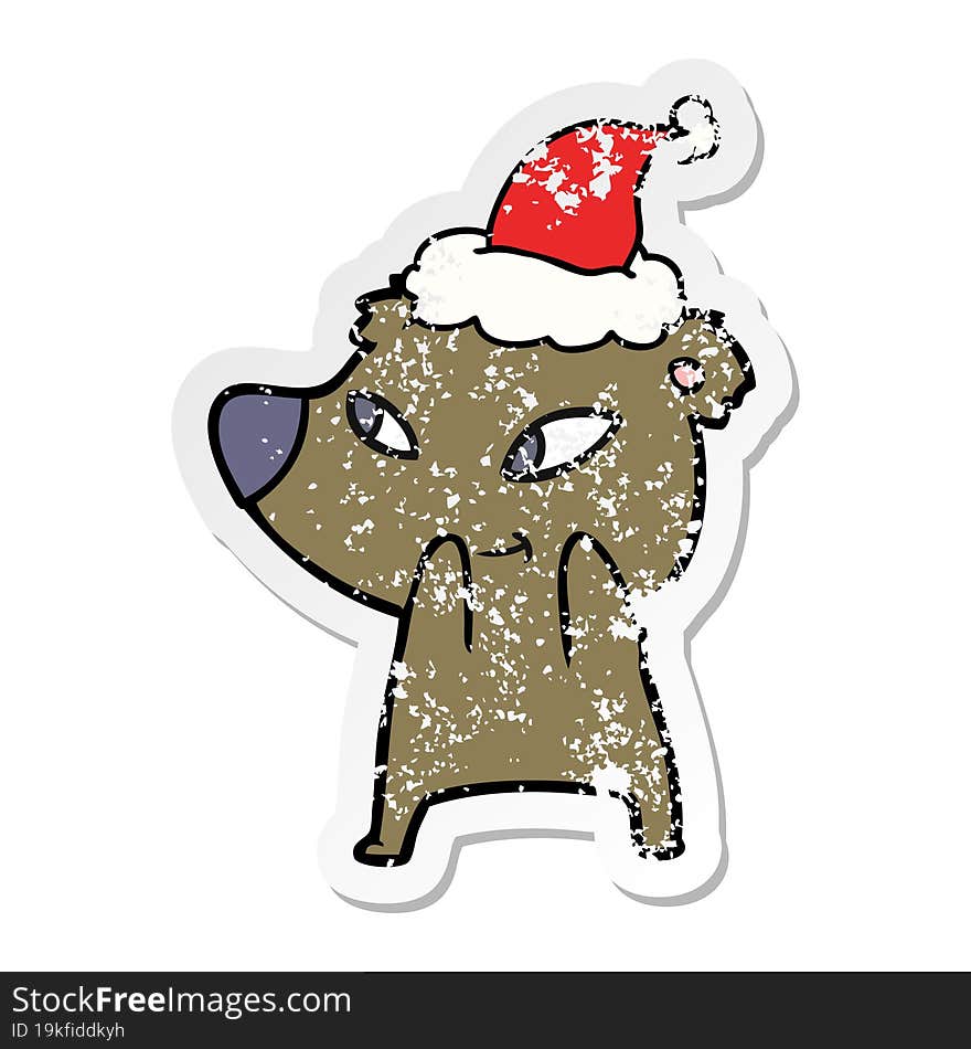 cute distressed sticker cartoon of a bear wearing santa hat