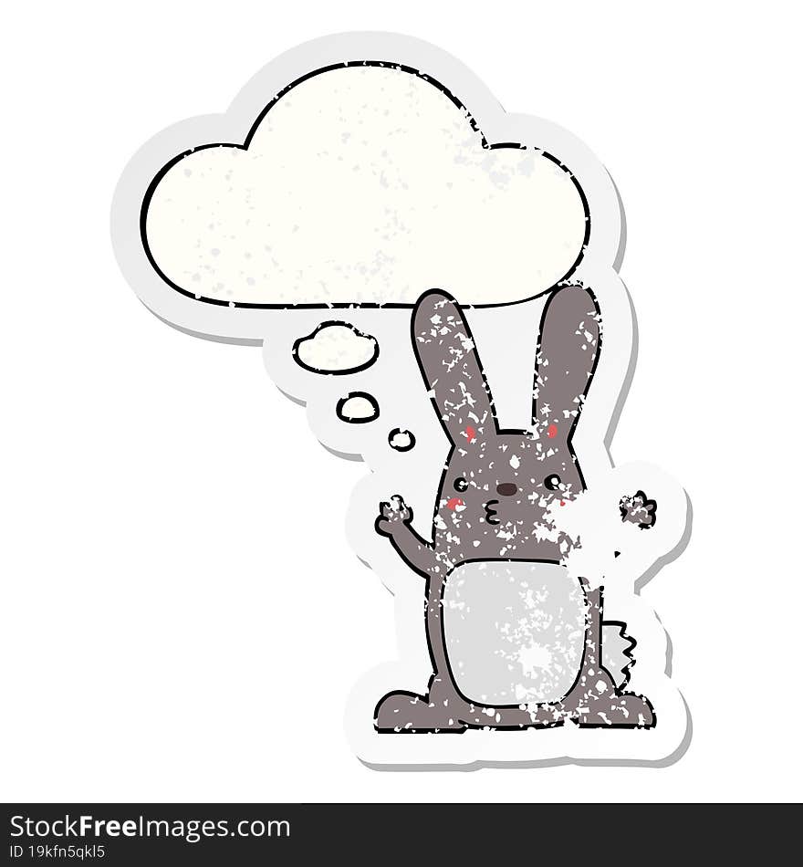 cartoon rabbit with thought bubble as a distressed worn sticker