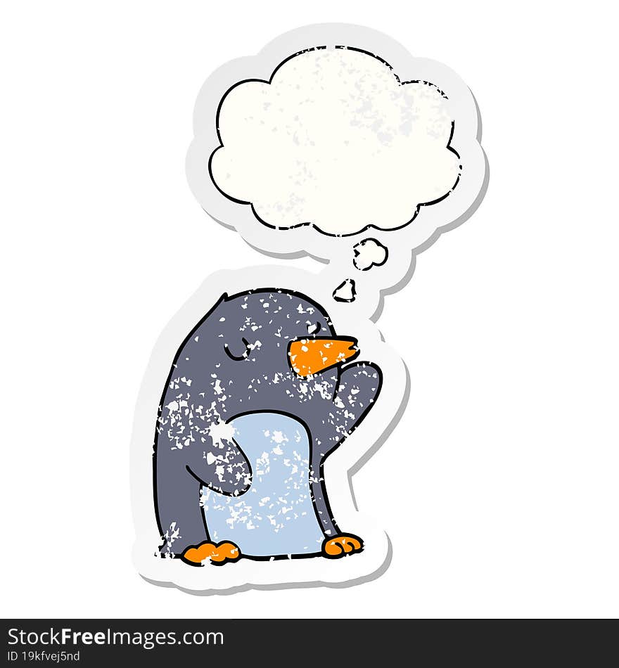 cartoon penguin and thought bubble as a distressed worn sticker