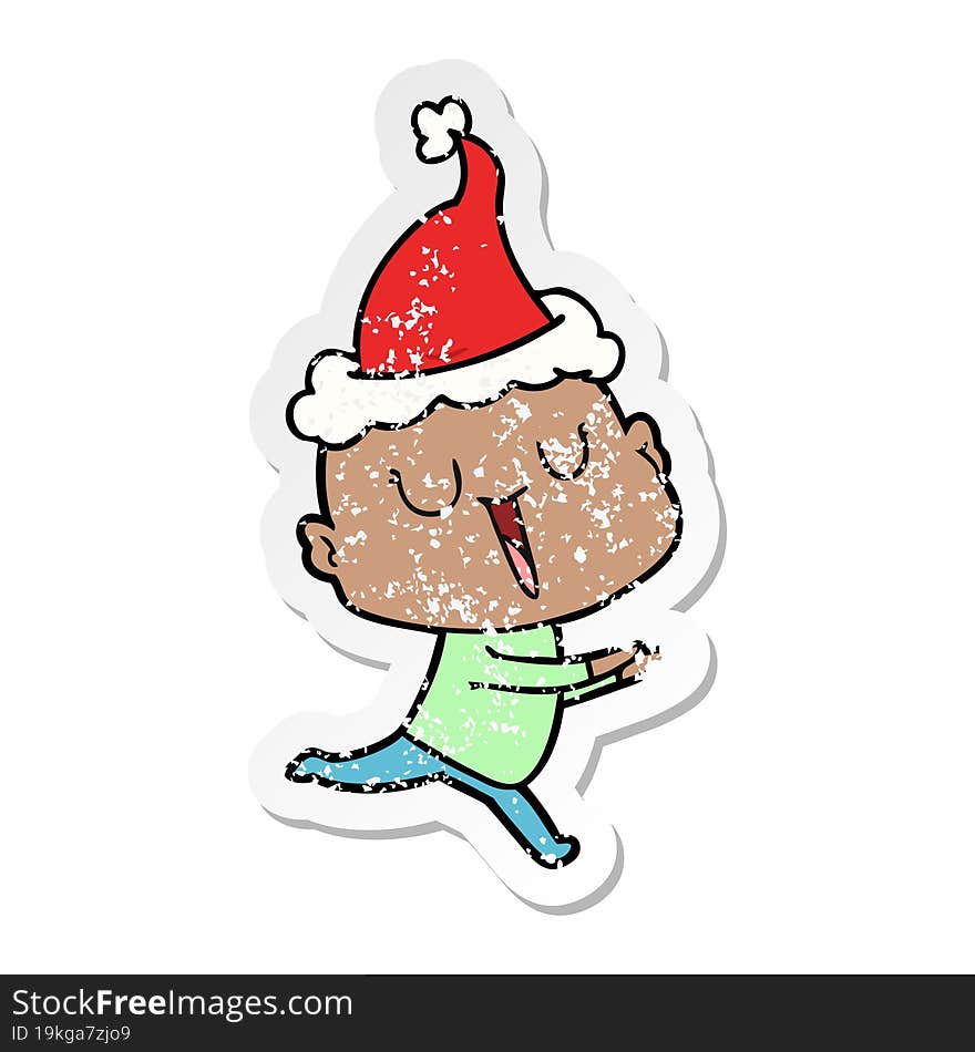 Happy Distressed Sticker Cartoon Of A Bald Man Wearing Santa Hat