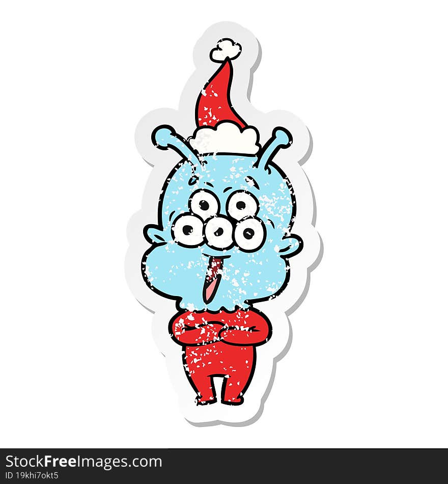 happy distressed sticker cartoon of a alien wearing santa hat