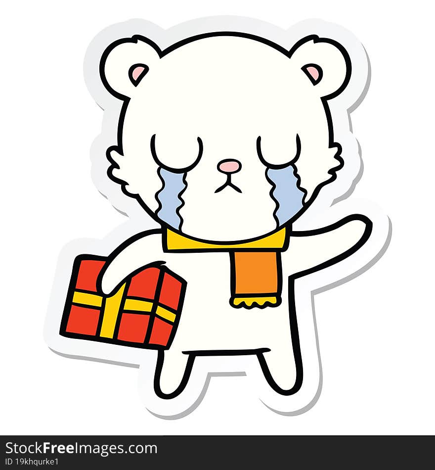 sticker of a crying polar bear cartoon with christmas gift