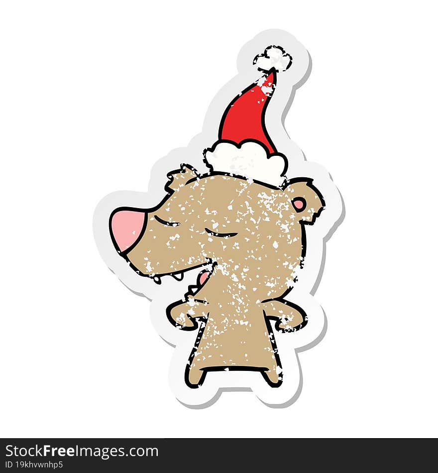 hand drawn distressed sticker cartoon of a bear wearing santa hat