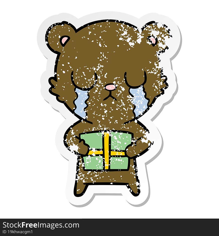 distressed sticker of a crying cartoon bear with present