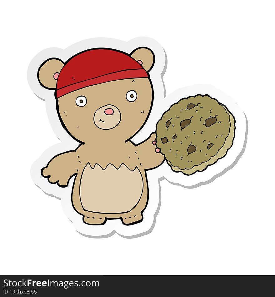 sticker of a cartoon teddy bear with cookie