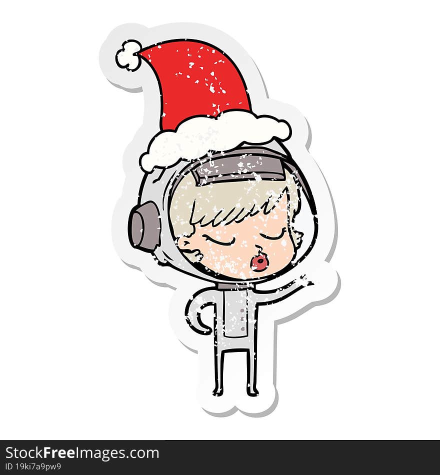 distressed sticker cartoon of a pretty astronaut girl wearing santa hat