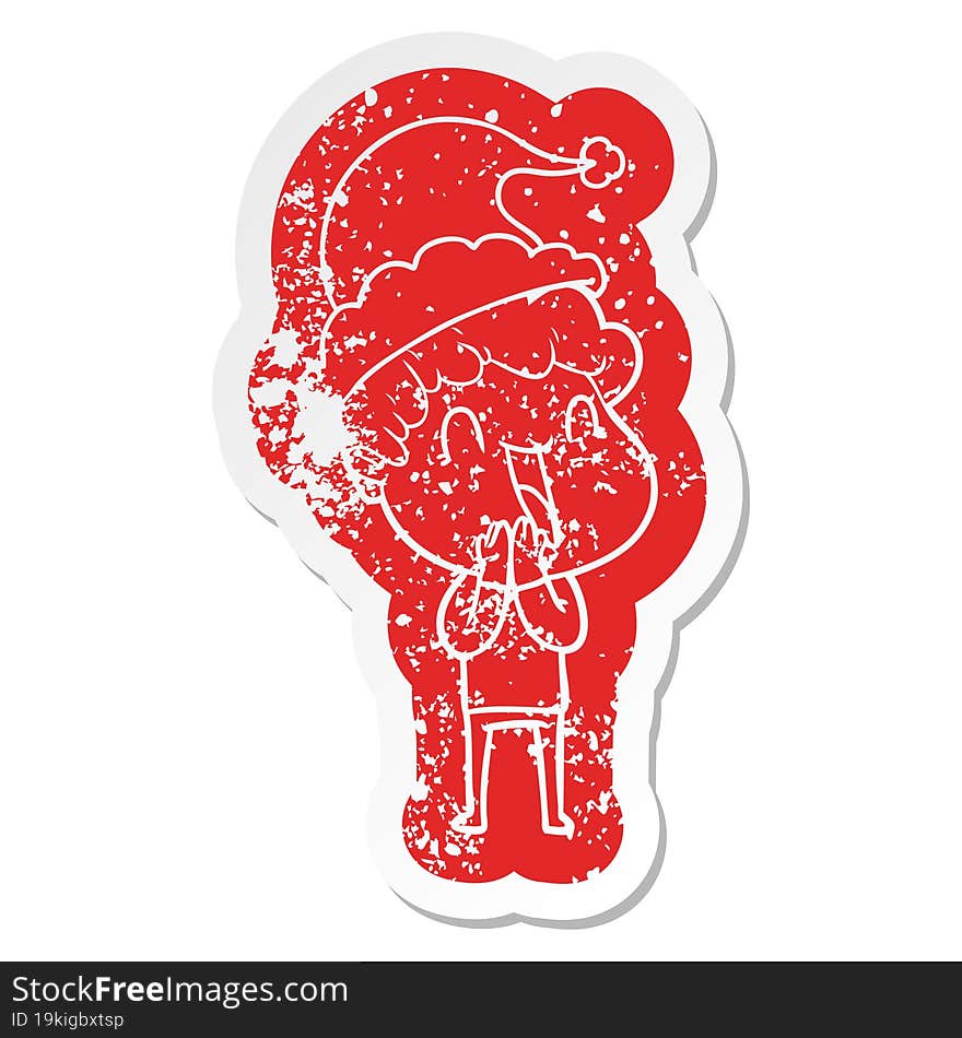 quirky cartoon distressed sticker of a happy man wearing santa hat