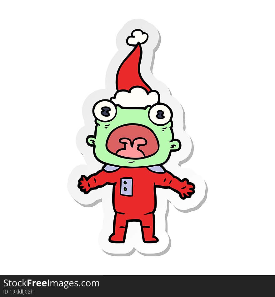 sticker cartoon of a weird alien communicating wearing santa hat