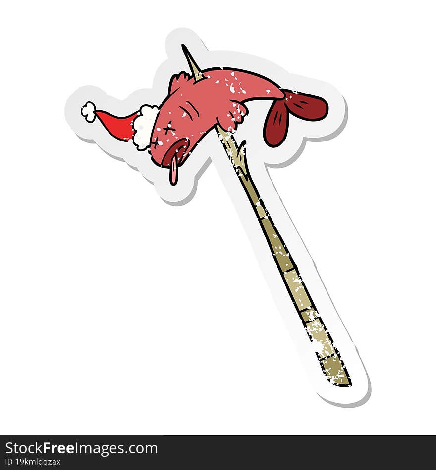 distressed sticker cartoon of a fish speared wearing santa hat