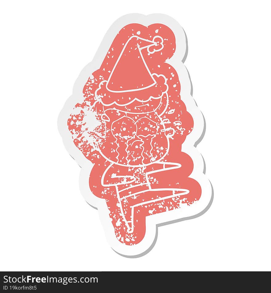 cartoon distressed sticker of a crying dancer wearing santa hat