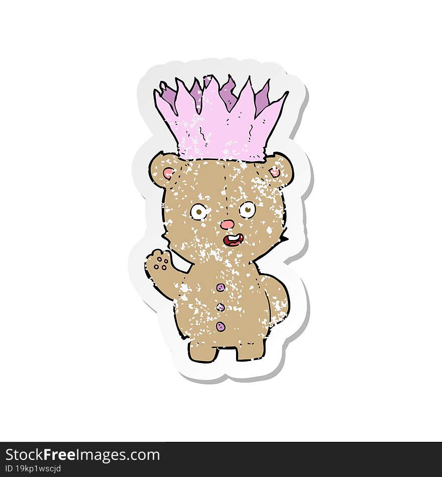 retro distressed sticker of a cartoon teddy bear wearing paper crown