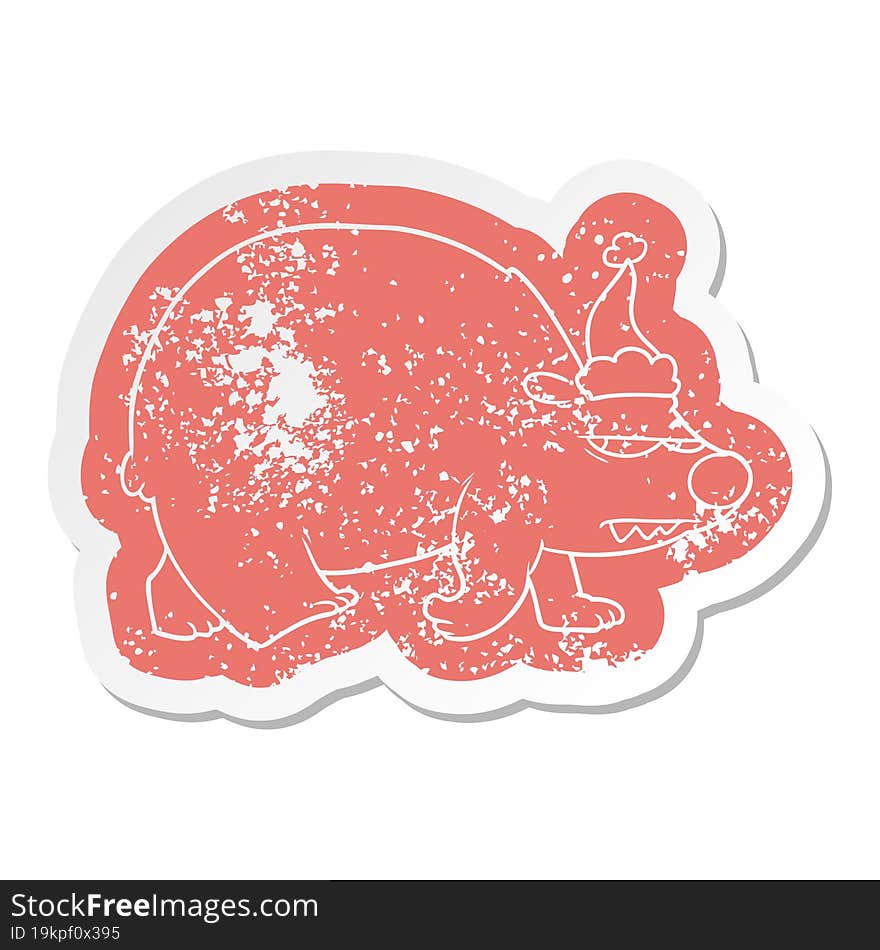 cartoon distressed sticker of a angry polar bear wearing santa hat