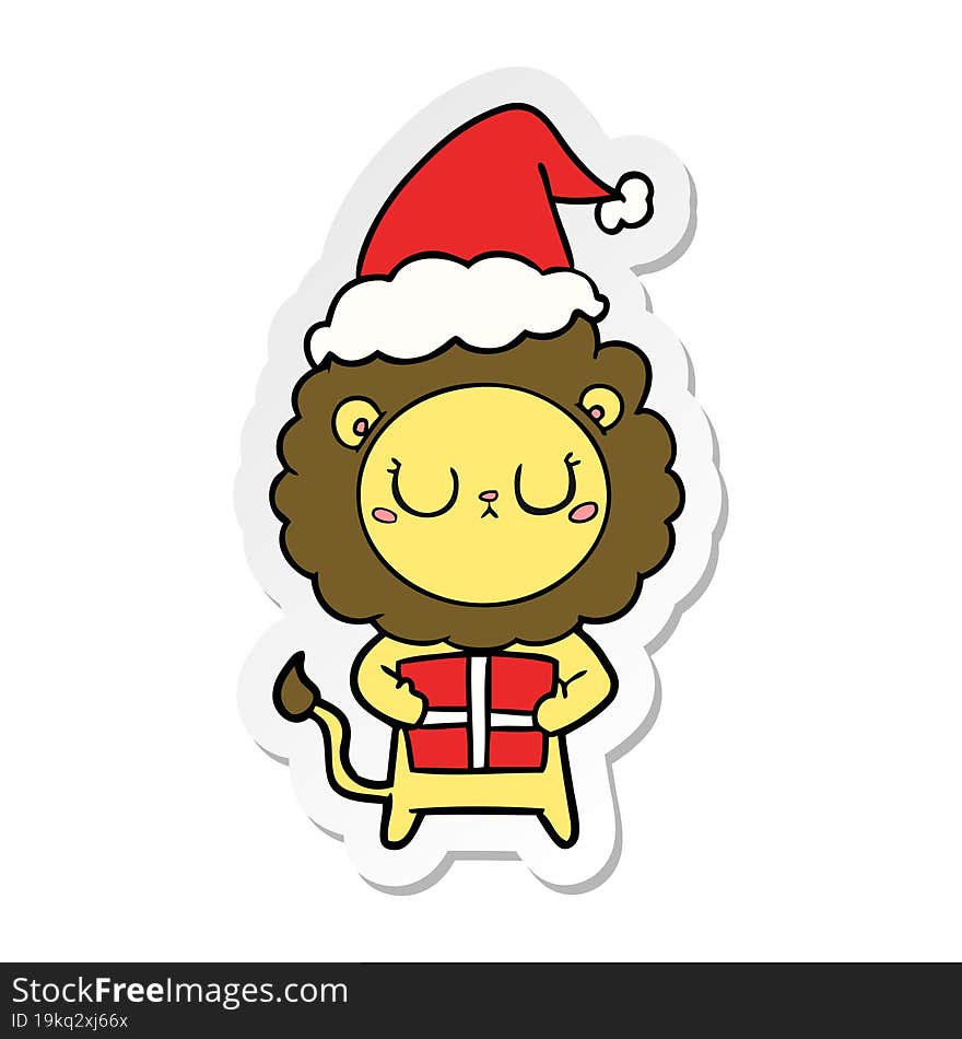 hand drawn sticker cartoon of a lion with christmas present wearing santa hat