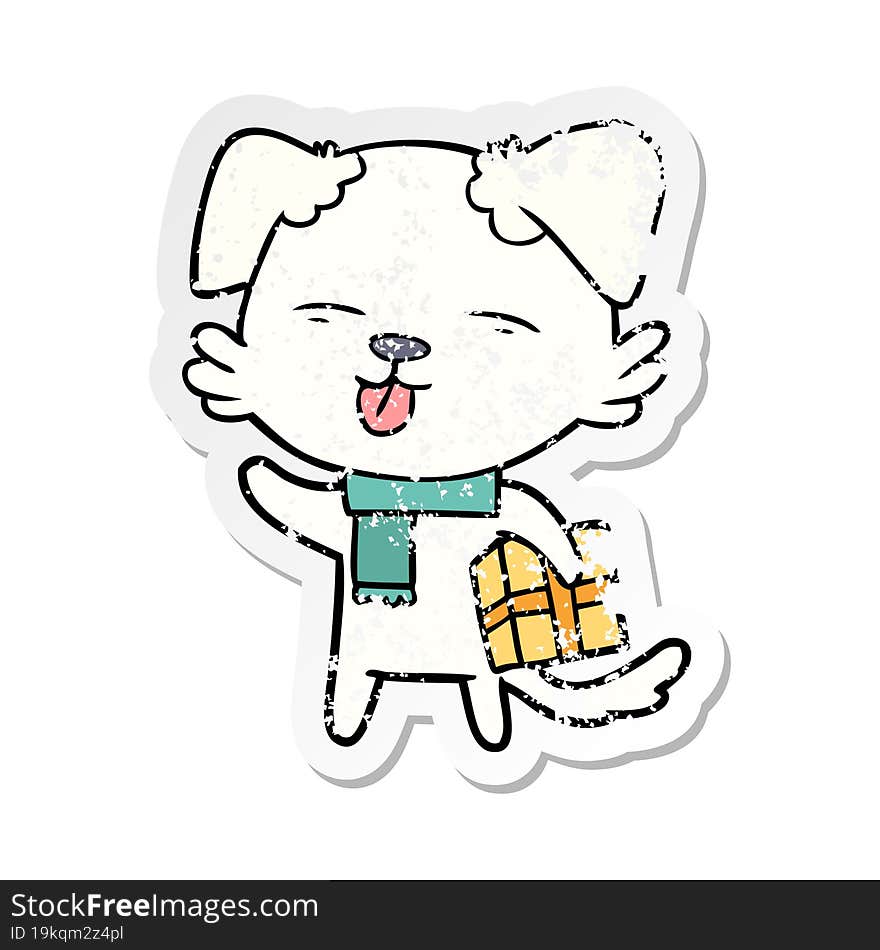 distressed sticker of a cartoon dog with xmas gift