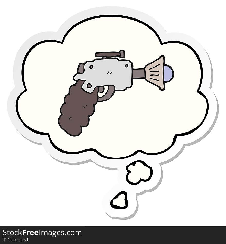 cartoon ray gun and thought bubble as a printed sticker