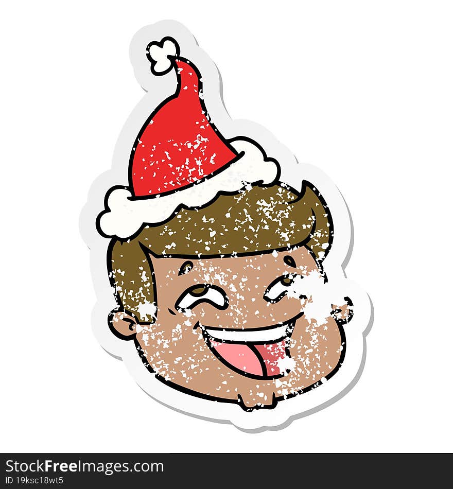 Happy Distressed Sticker Cartoon Of A Male Face Wearing Santa Hat