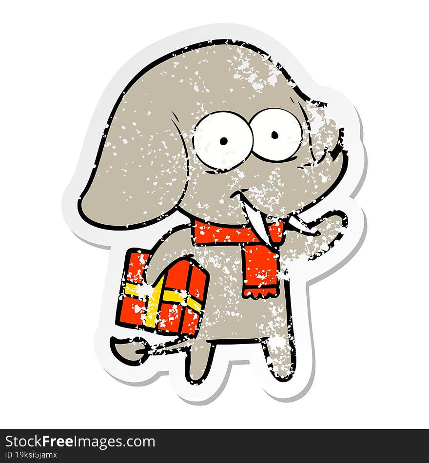 distressed sticker of a happy cartoon elephant with present