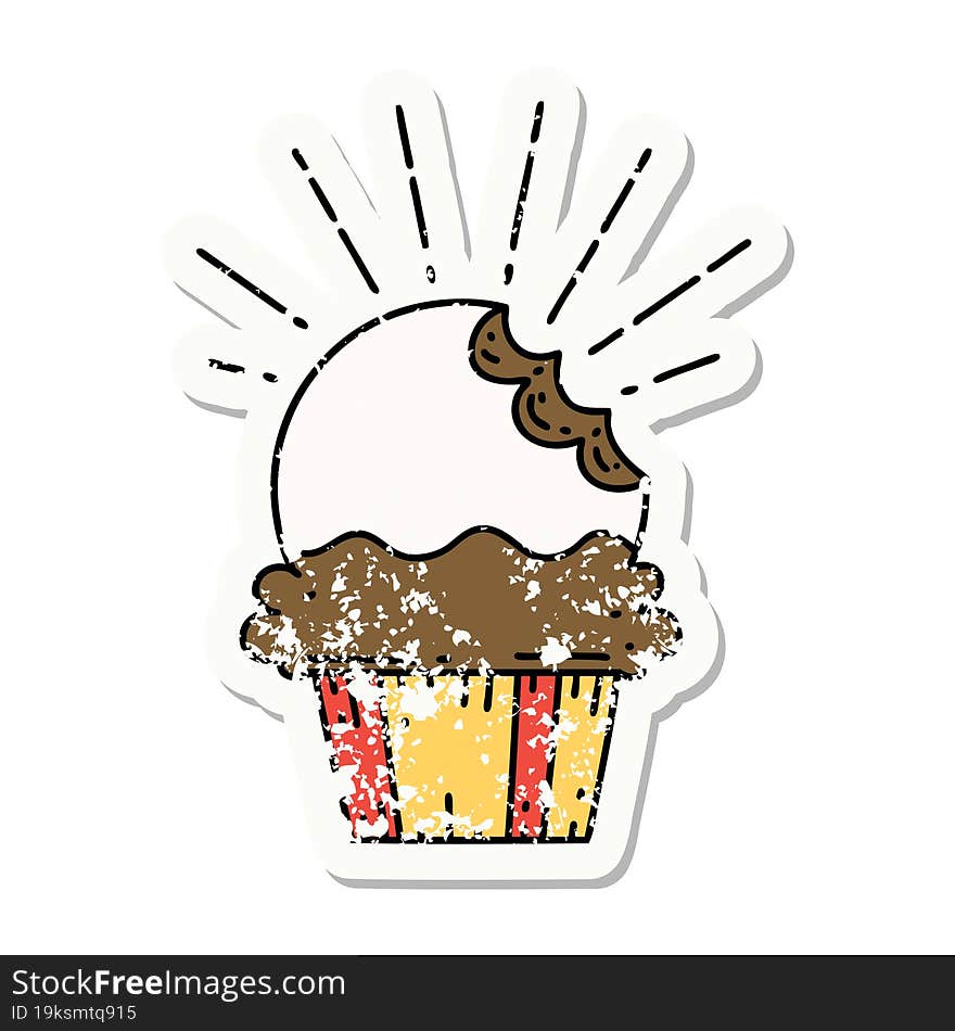 grunge sticker of tattoo style cupcake with missing bite