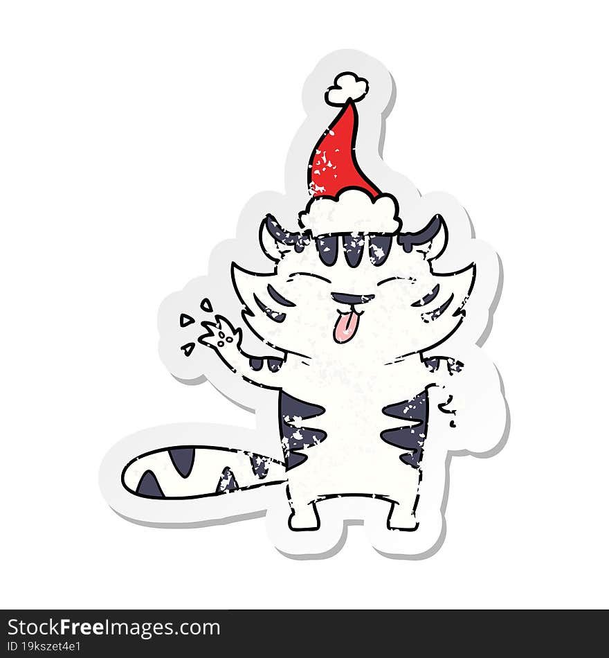 distressed sticker cartoon of a white tiger wearing santa hat