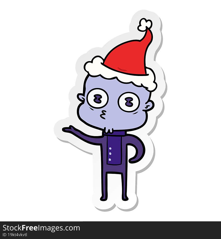 sticker cartoon of a weird bald spaceman wearing santa hat