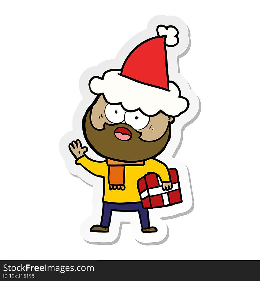 sticker cartoon of a bearded man with present wearing santa hat