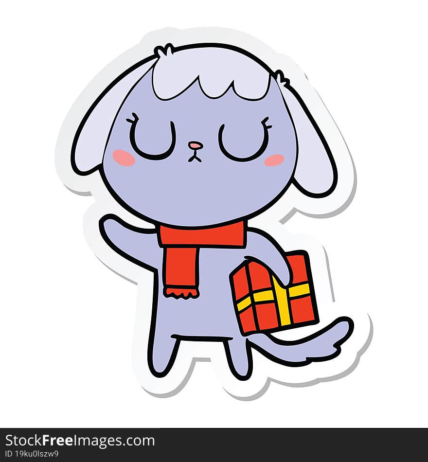 sticker of a cute cartoon dog with christmas present