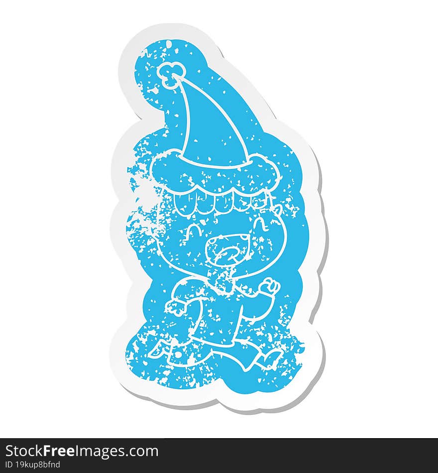 cartoon distressed sticker of a happy boy laughing and running away wearing santa hat