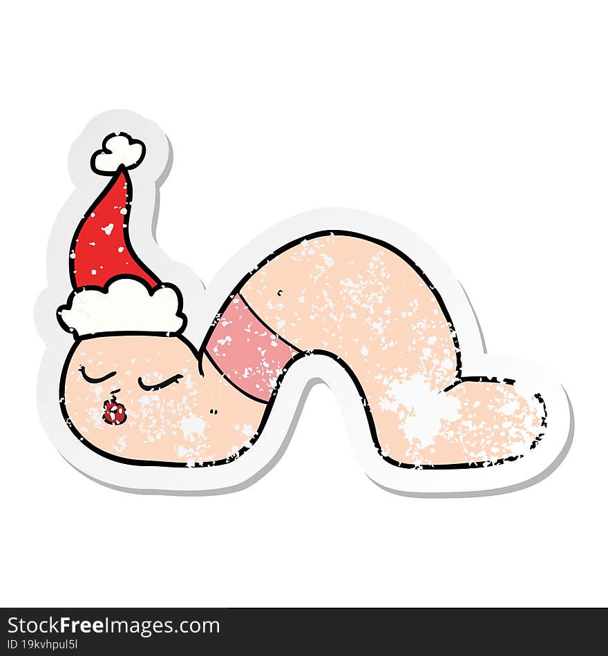 distressed sticker cartoon of a worm wearing santa hat