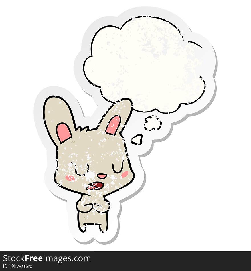 cartoon rabbit talking with thought bubble as a distressed worn sticker