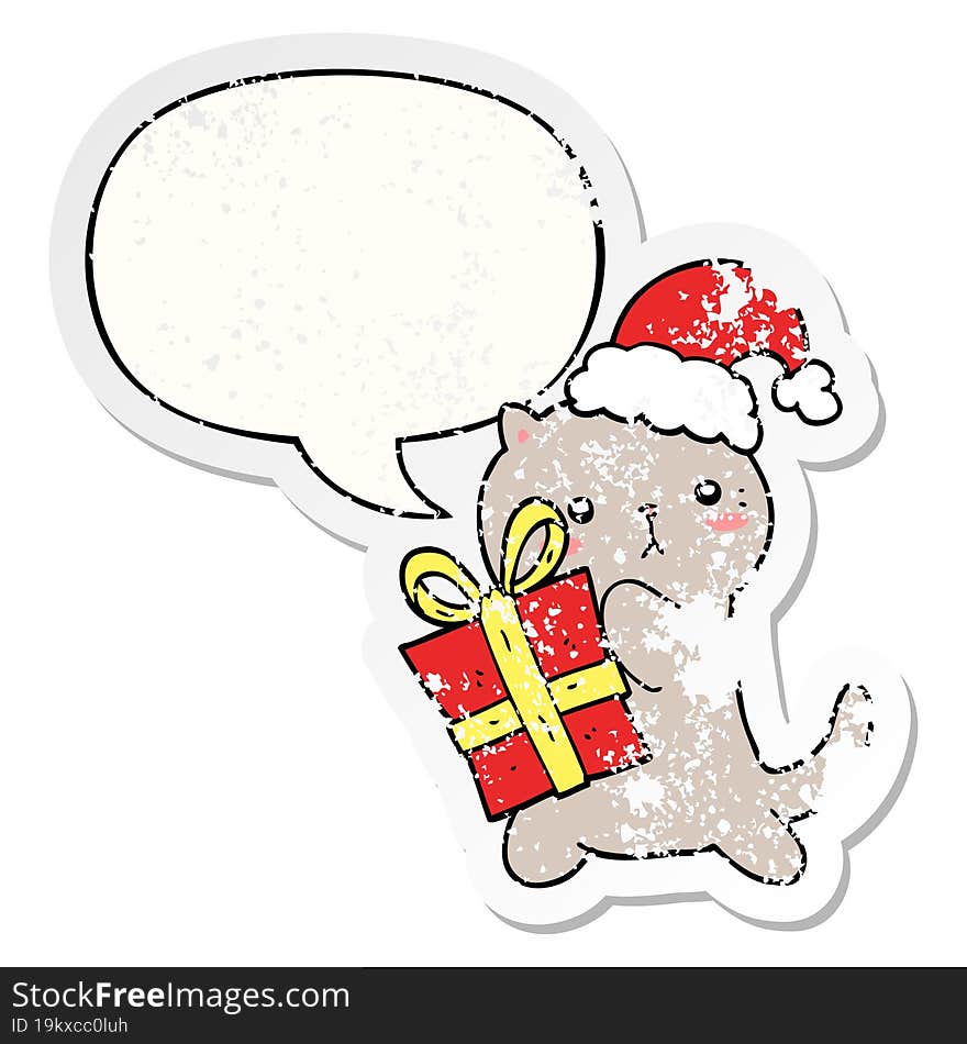 cute cartoon cat carrying christmas present and speech bubble distressed sticker