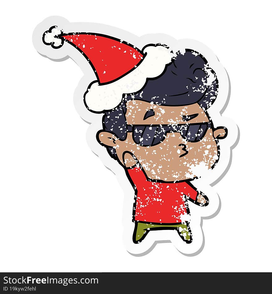 distressed sticker cartoon of a cool guy wearing santa hat