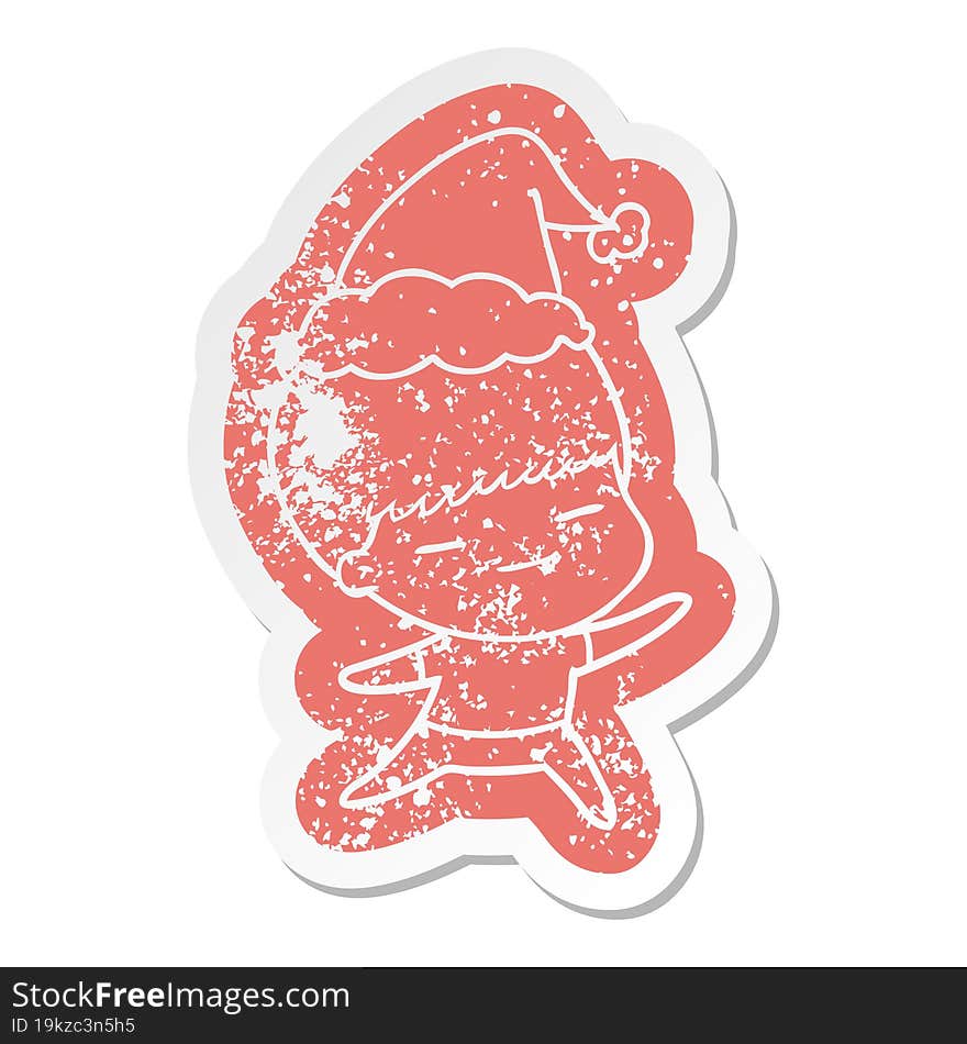 cartoon distressed sticker of a smug boy wearing santa hat