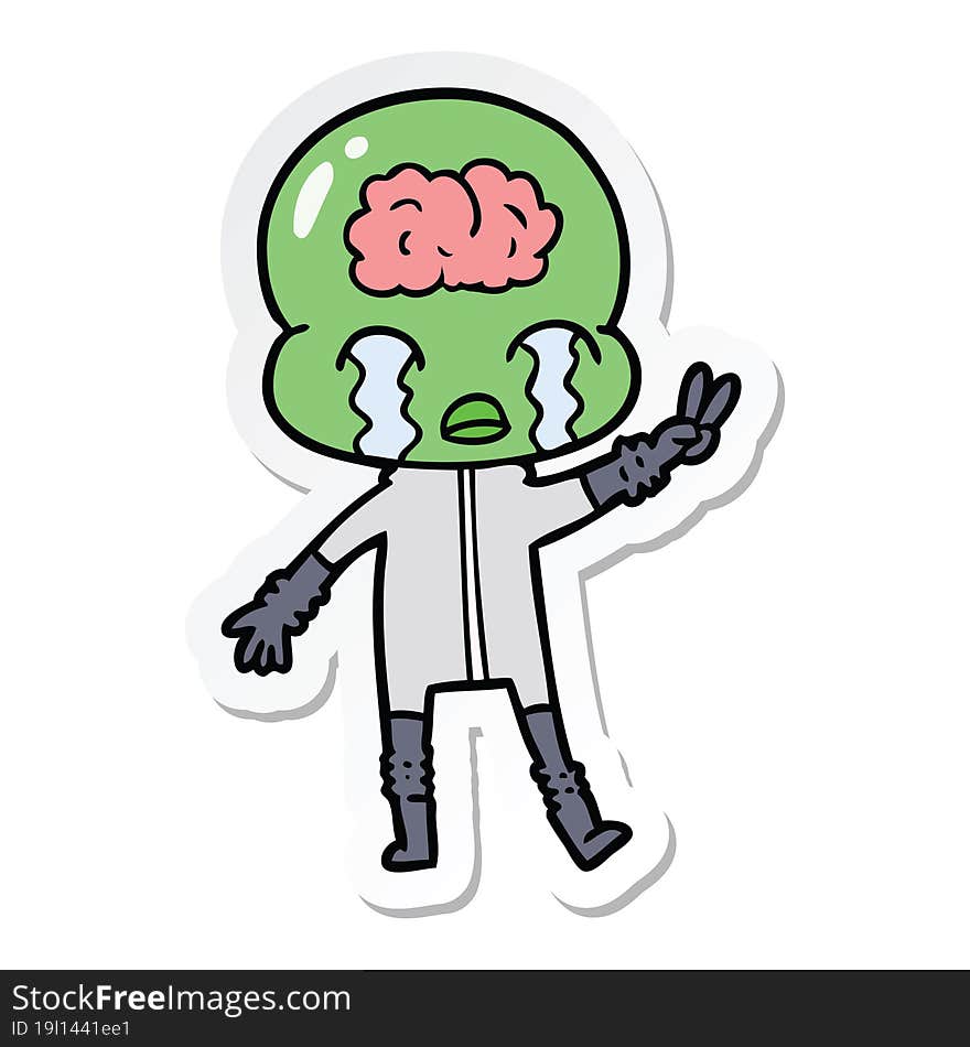 Sticker Of A Cartoon Big Brain Alien Crying And Giving Peace Sign