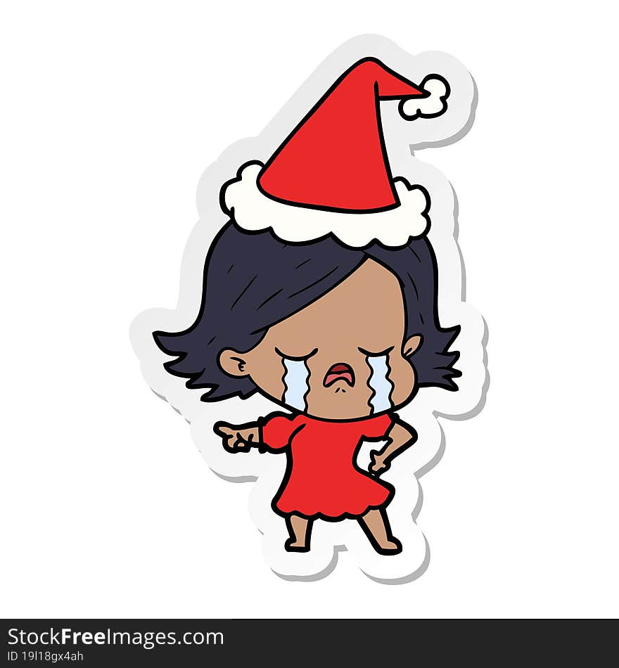 Sticker Cartoon Of A Girl Crying And Pointing Wearing Santa Hat