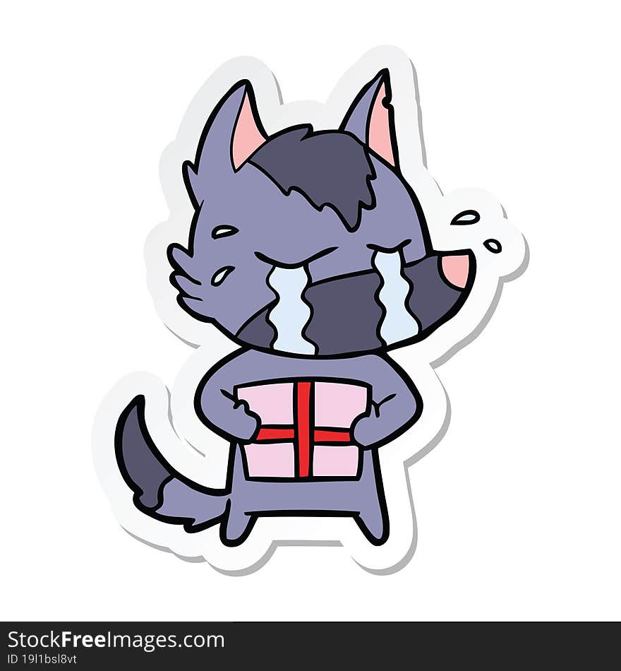 sticker of a cartoon crying wolf with christmas present