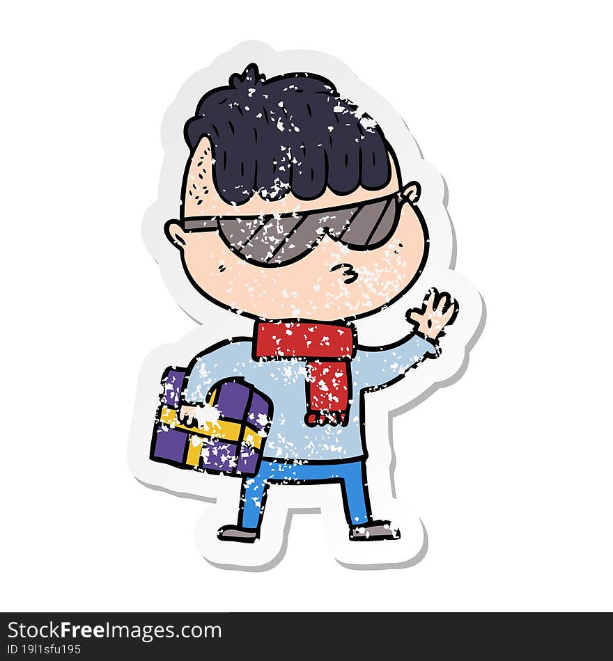 distressed sticker of a cartoon boy wearing sunglasses carrying xmas gift