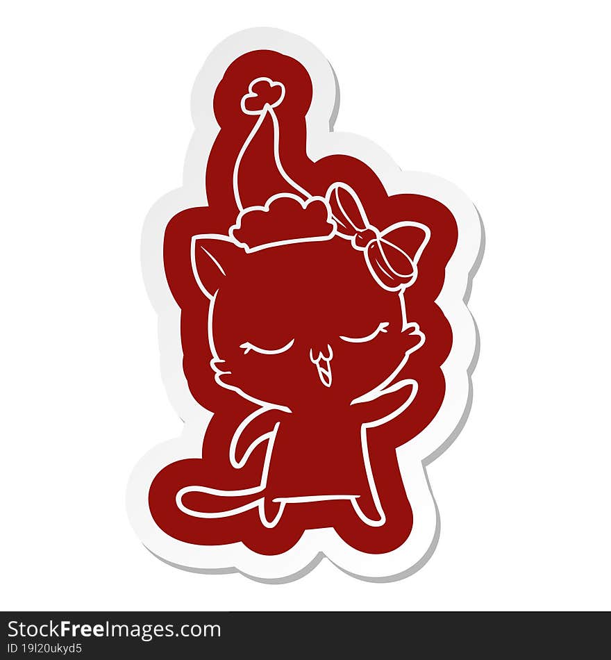 cartoon  sticker of a cat with bow on head wearing santa hat