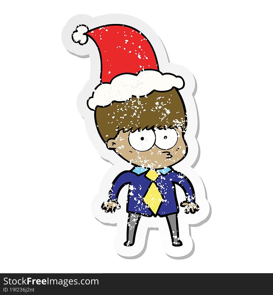 nervous distressed sticker cartoon of a boy wearing shirt and tie wearing santa hat