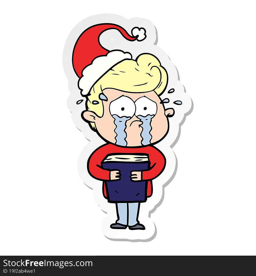 Sticker Cartoon Of A Crying Man Holding Book Wearing Santa Hat