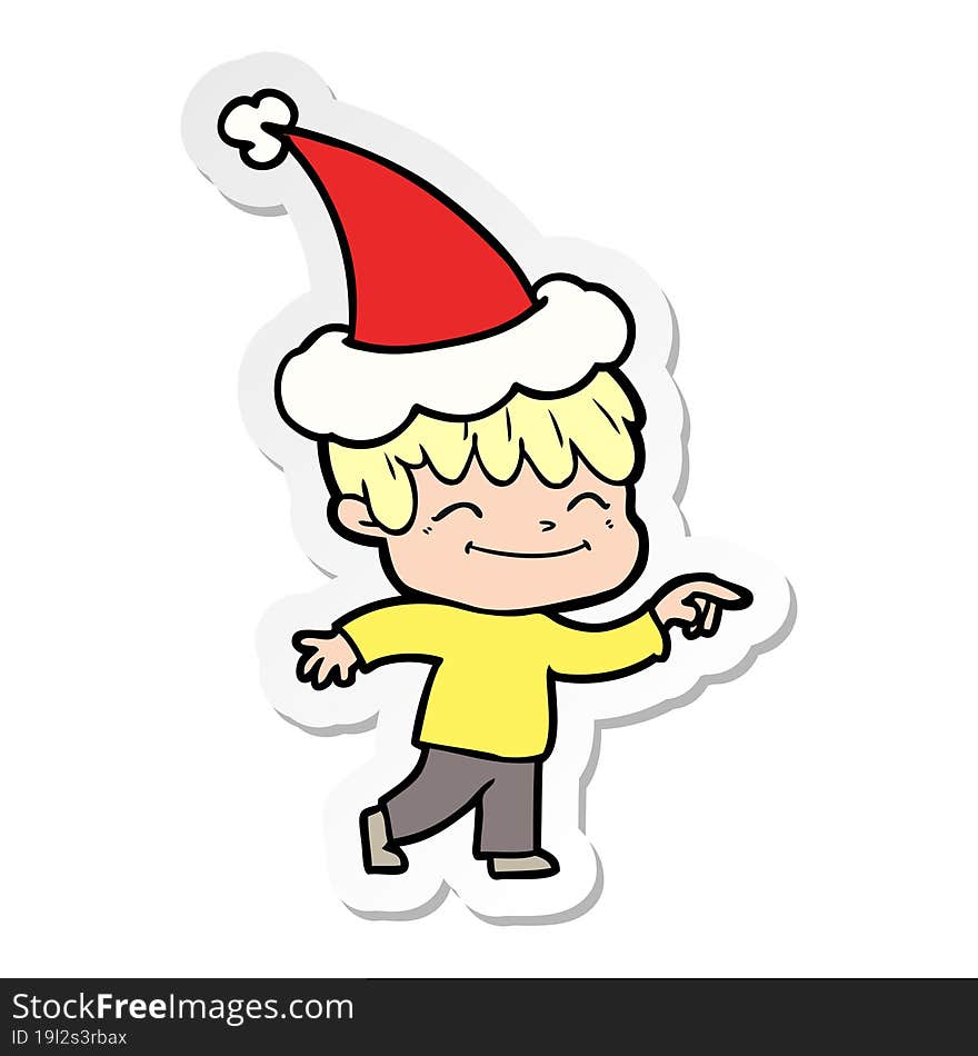 sticker cartoon of a happy boy wearing santa hat