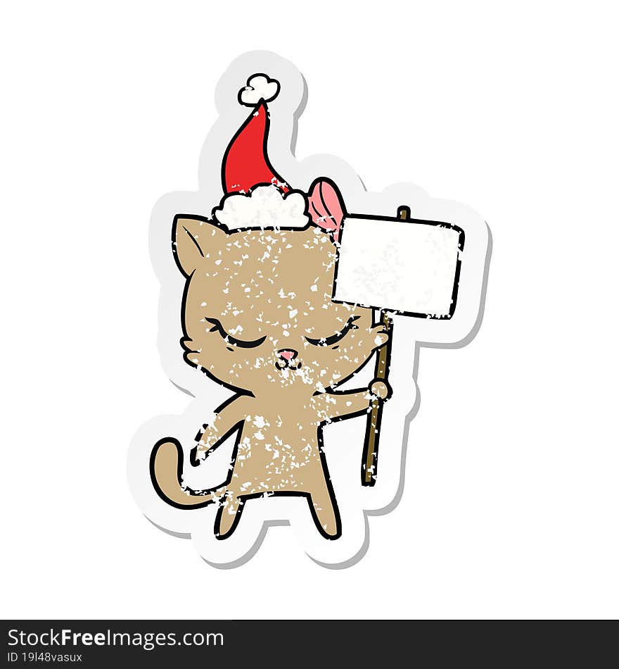 cute distressed sticker cartoon of a cat with sign wearing santa hat