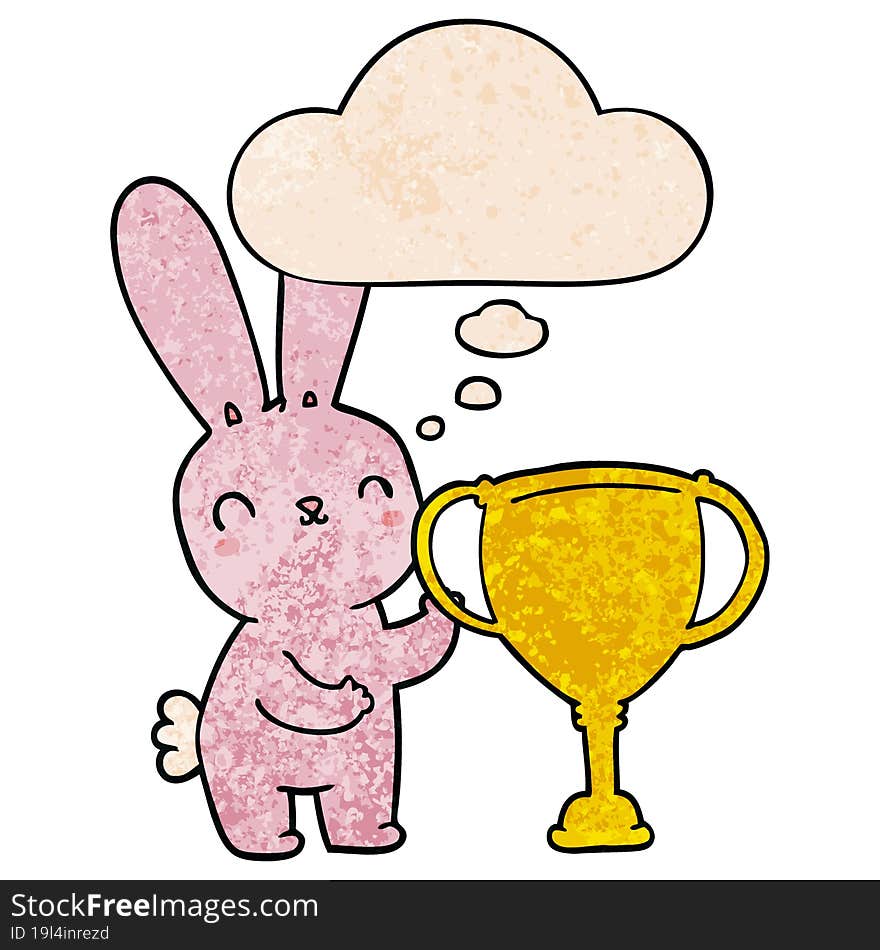 cute cartoon rabbit with sports trophy cup with thought bubble in grunge texture style. cute cartoon rabbit with sports trophy cup with thought bubble in grunge texture style