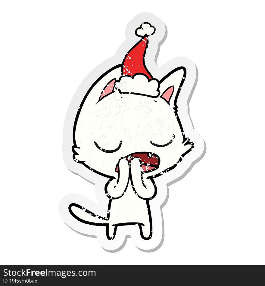 talking cat distressed sticker cartoon of a wearing santa hat