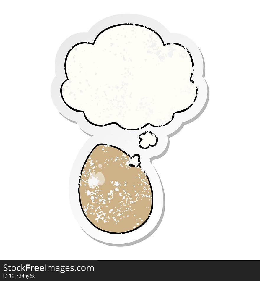 cartoon egg and thought bubble as a distressed worn sticker