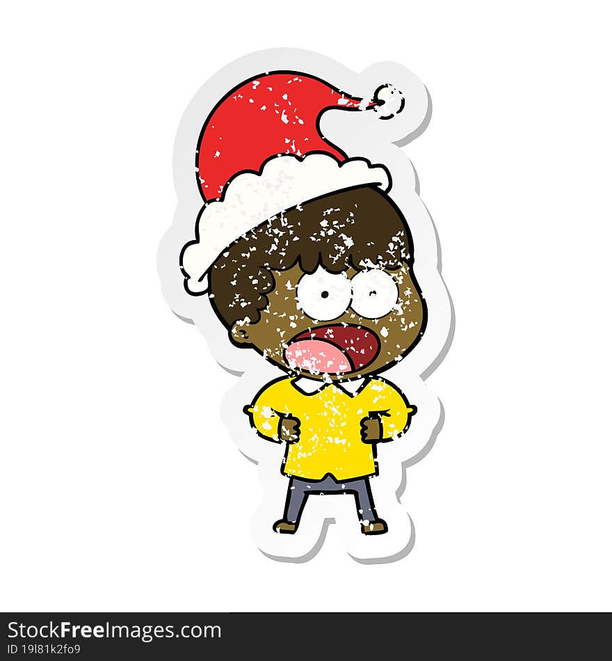 Distressed Sticker Cartoon Of A Shocked Man Wearing Santa Hat