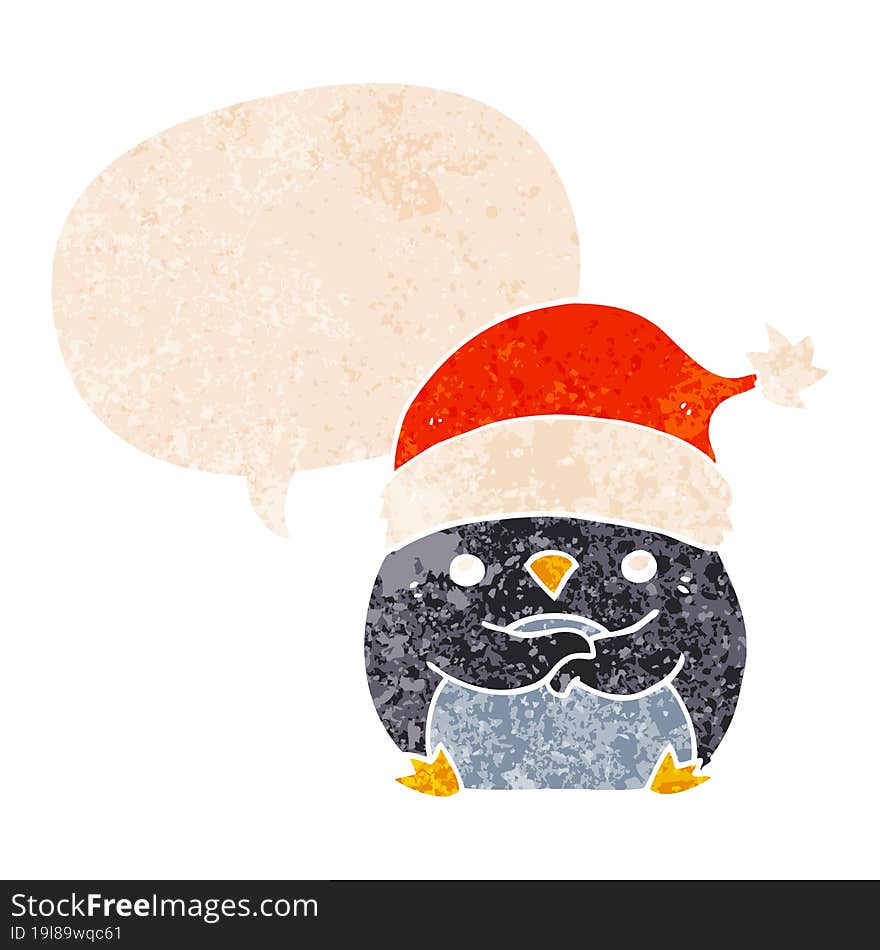 cute cartoon penguin wearing christmas hat and speech bubble in retro textured style