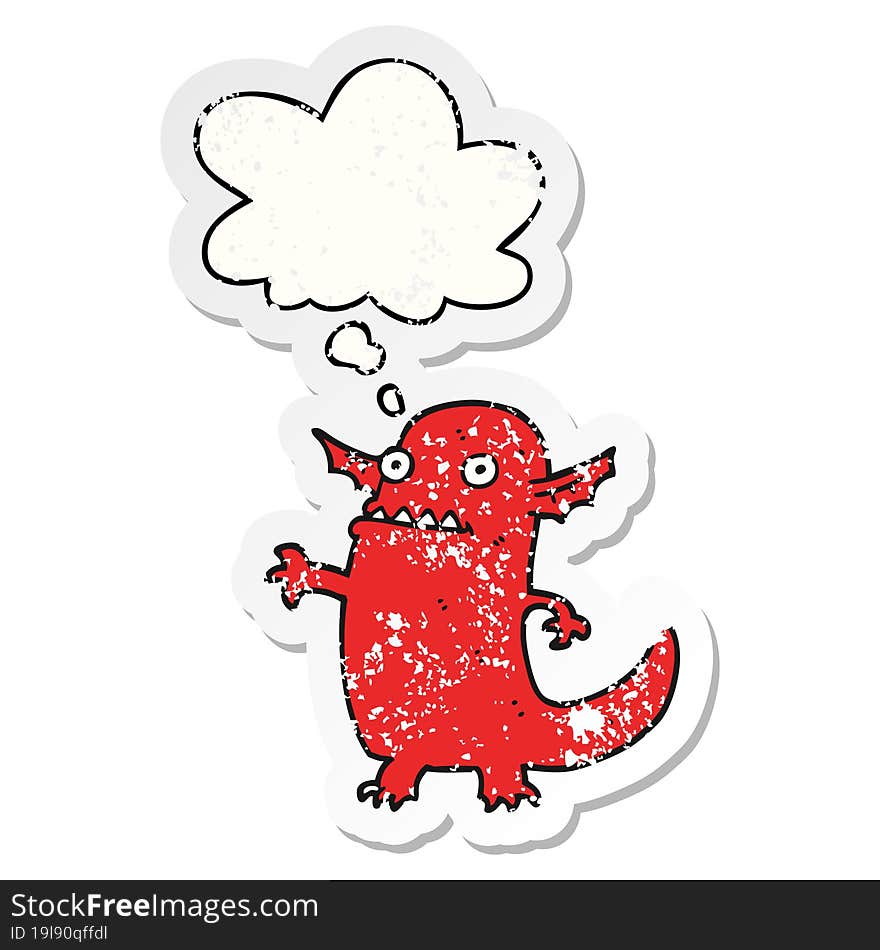 cartoon halloween monster with thought bubble as a distressed worn sticker