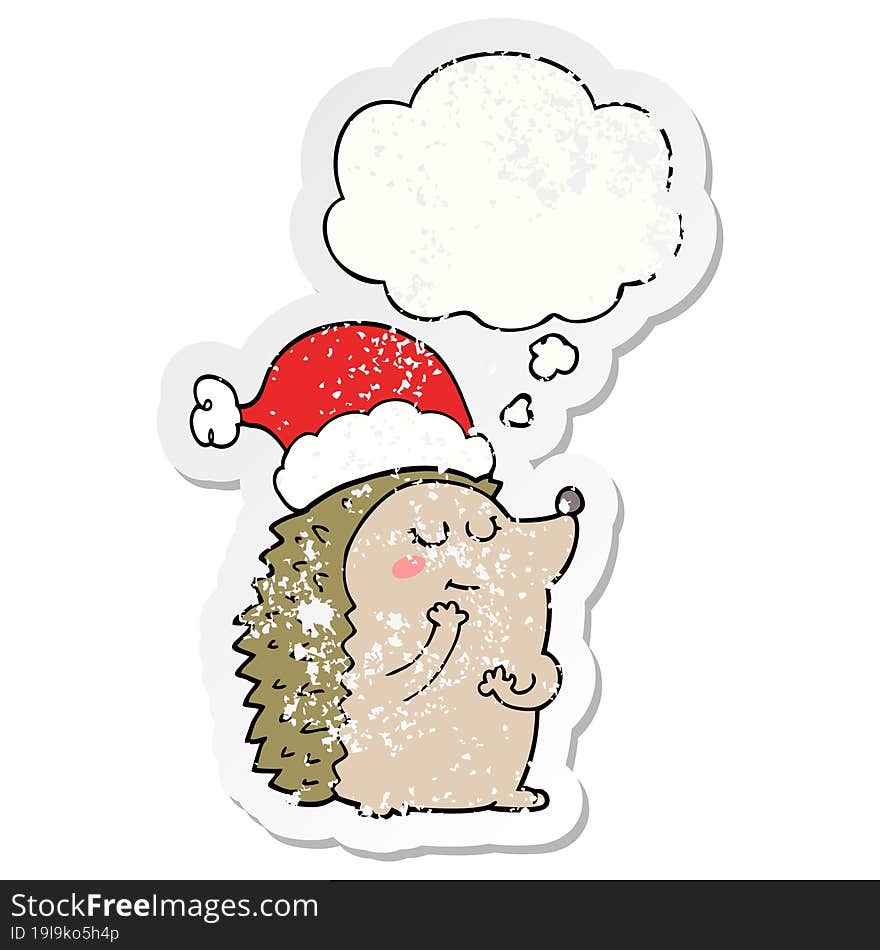 cartoon hedgehog wearing christmas hat and thought bubble as a distressed worn sticker