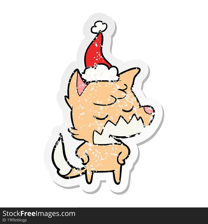 friendly distressed sticker cartoon of a fox wearing santa hat